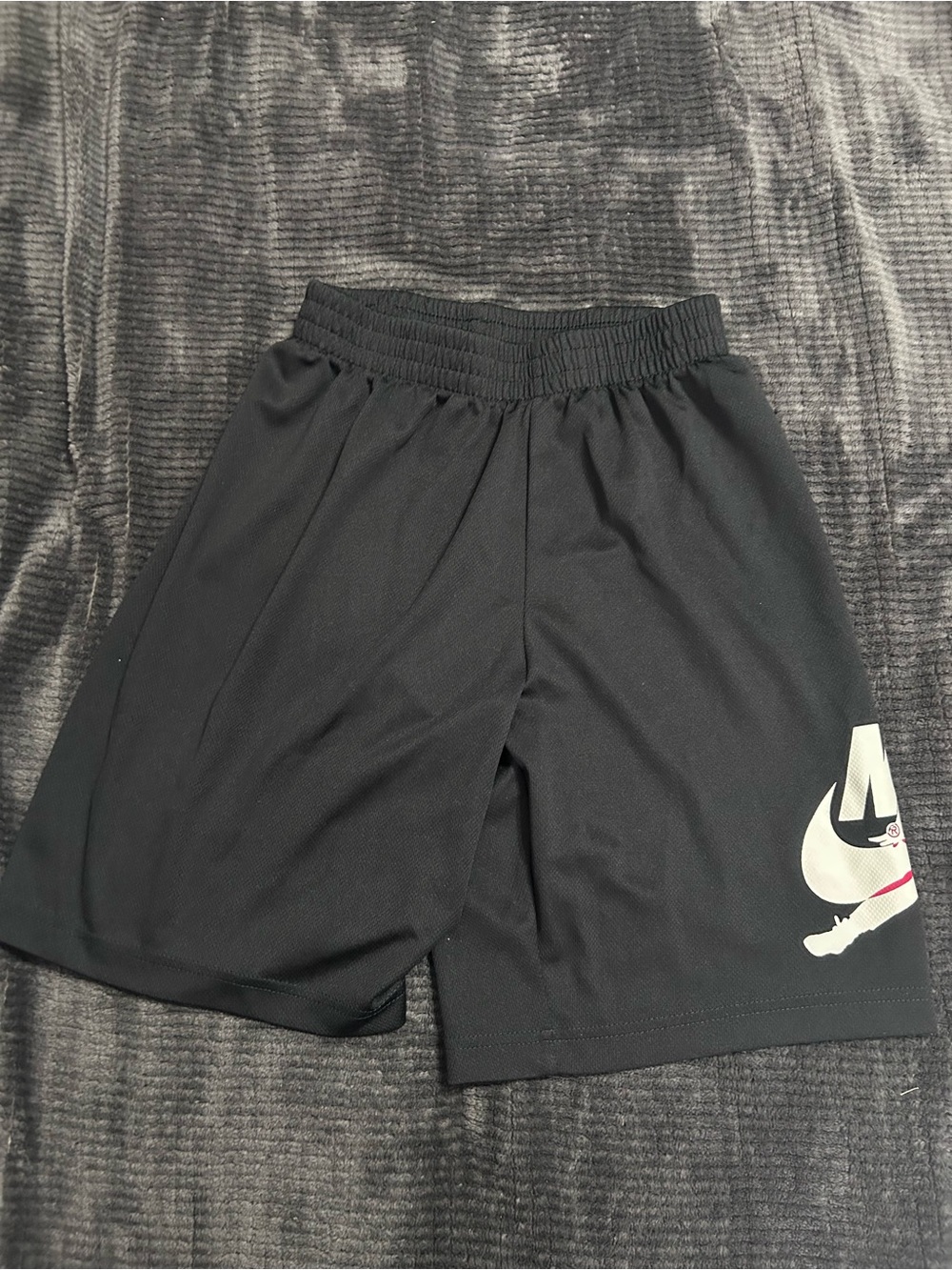 16. Nike Black Athletic Shorts with White Swoosh Accent